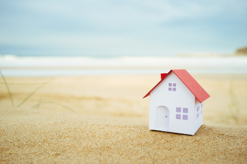 A small house model on the beach
